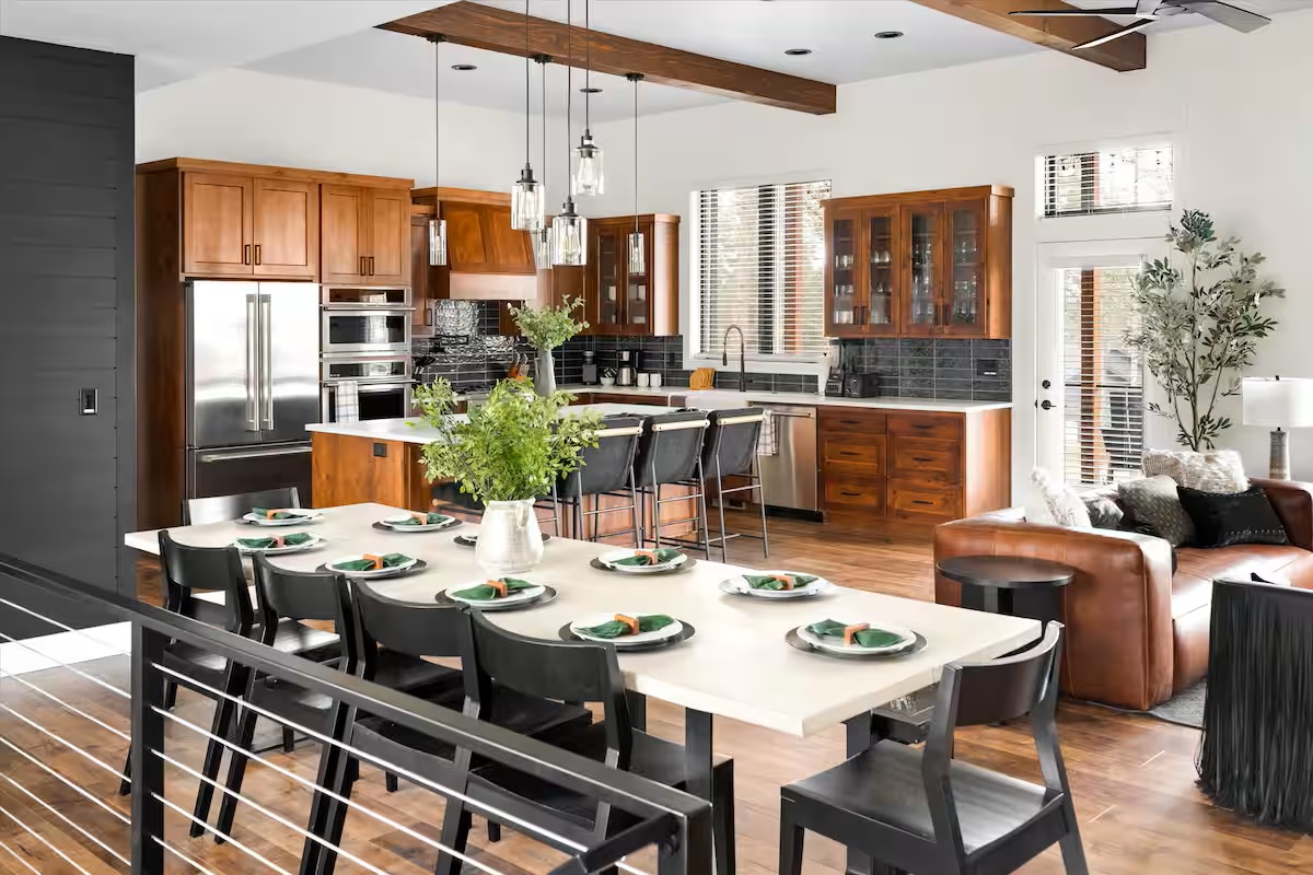 The Evergreen kitchen island and long dining table prepared for a group meal