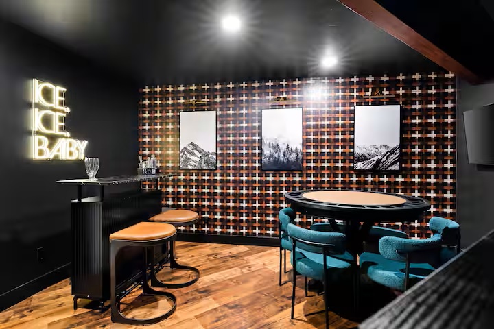 The Evergreen speakeasy with a poker table, bar counter and neon sign